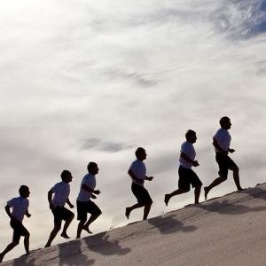 Group running up a hill