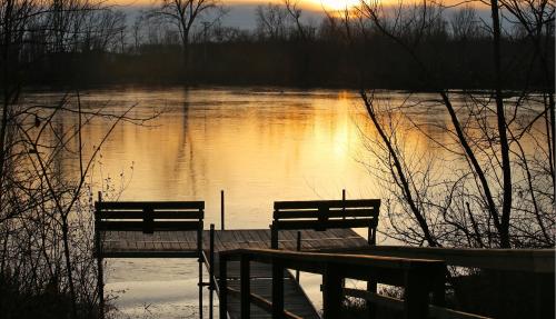 Sun setting over lake