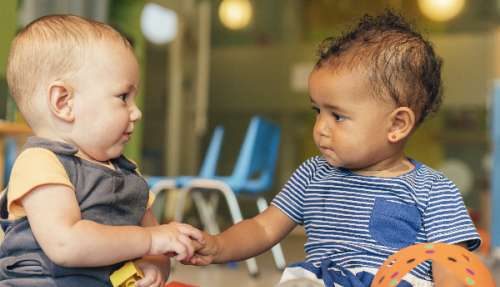 Two babies playing