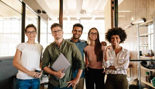 Group of coworkers standing side by side