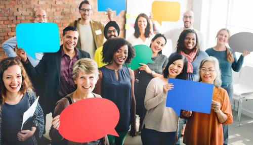 Business people holding speech bubbles
